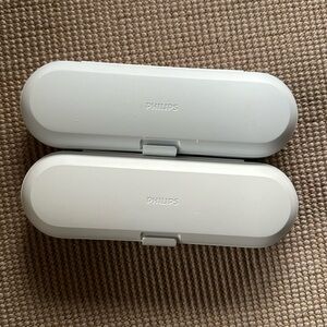 2 Philips electric toothbrush cases